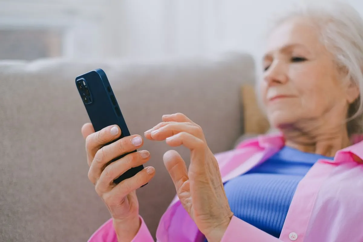 Older woman using a smartphone at home